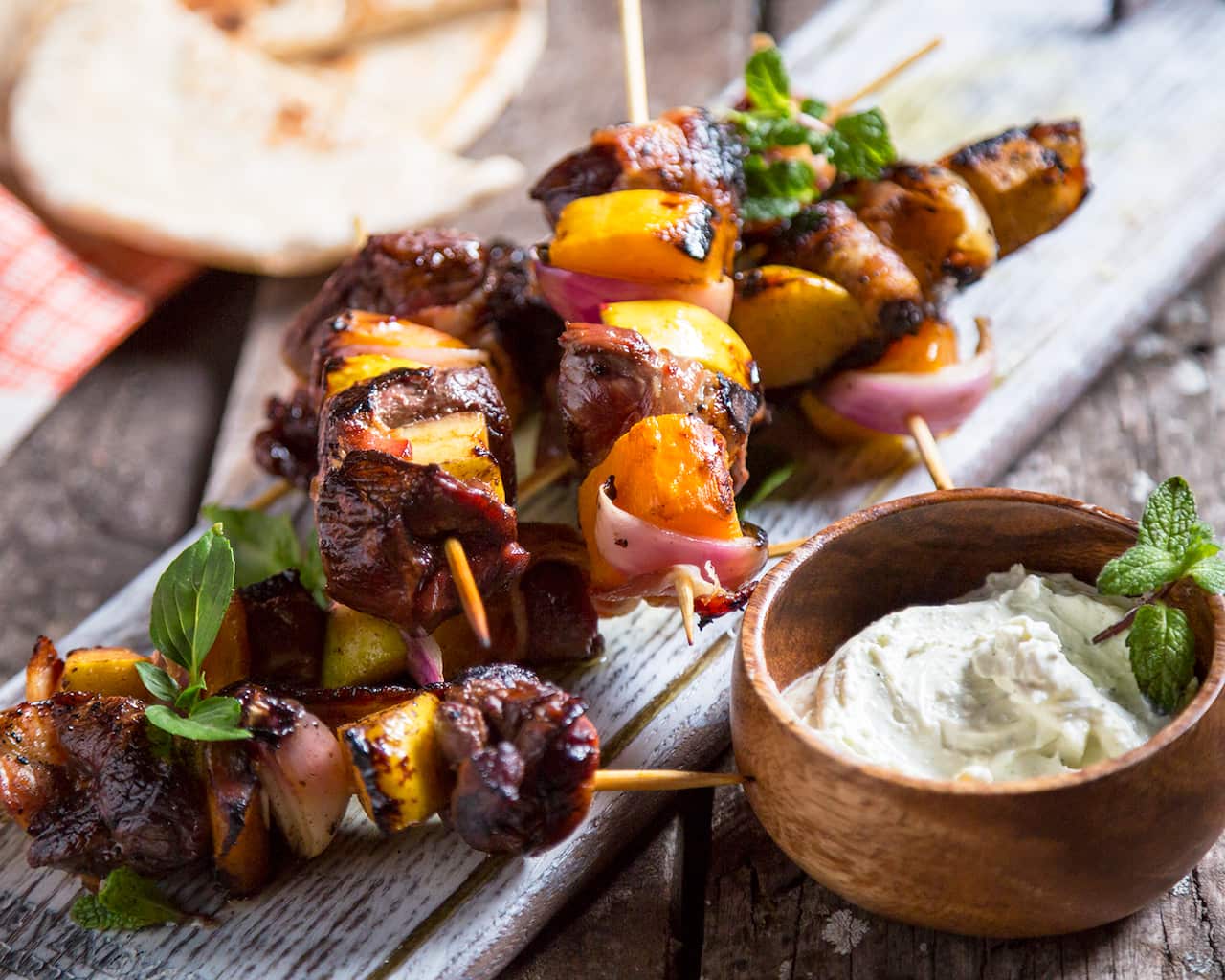 Venison skewers with red onion, roasted butternut and whipped feta