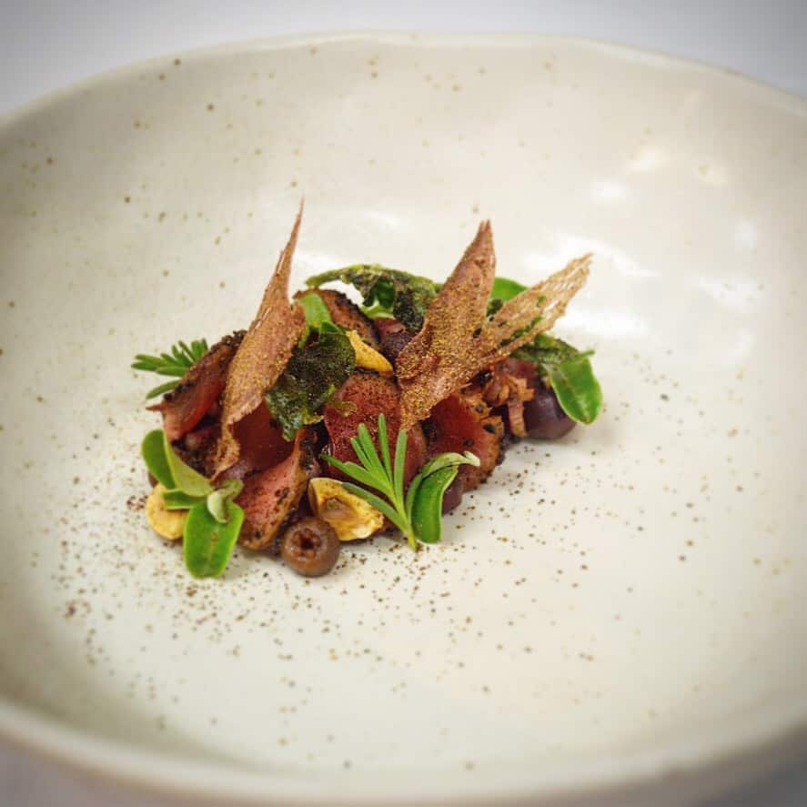 Wallaby rolled in wattle seed, pickled muntries, hazlenuts, and coastal greens is a house favourite.