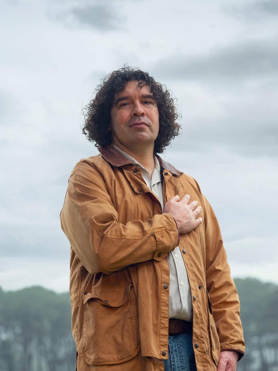 Warrawatja Bell with his hand on his heart to demonstrate the importance of heart health. 