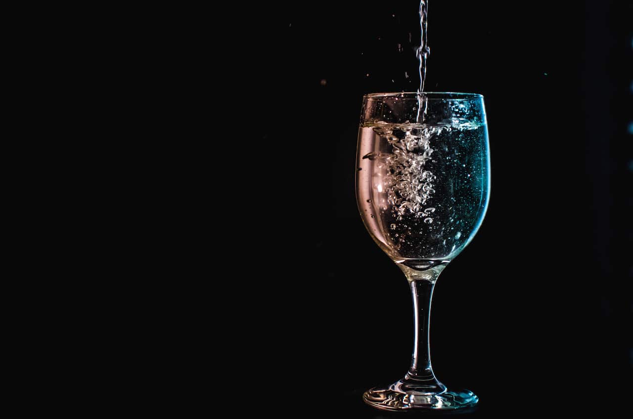 Drink water from a wine glass