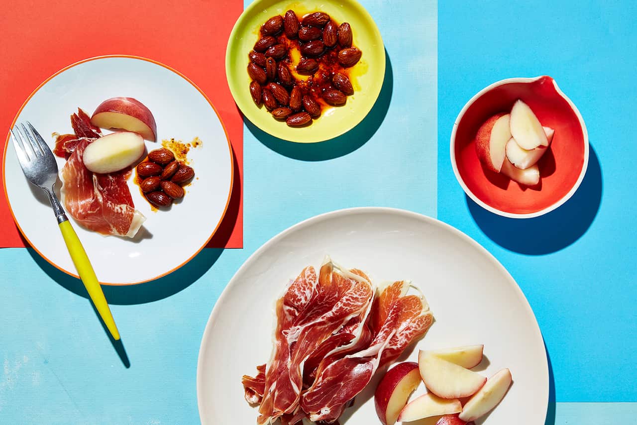 White nectarines with jamon and roasted almonds
