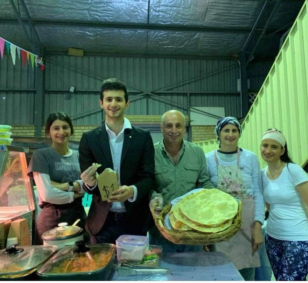Diyana with her family at the markets in Iraq.