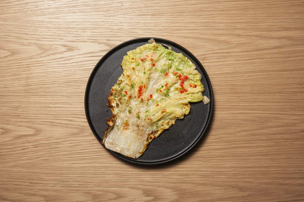 Wombok crisp-edged pancake at Sáng by Mabasa