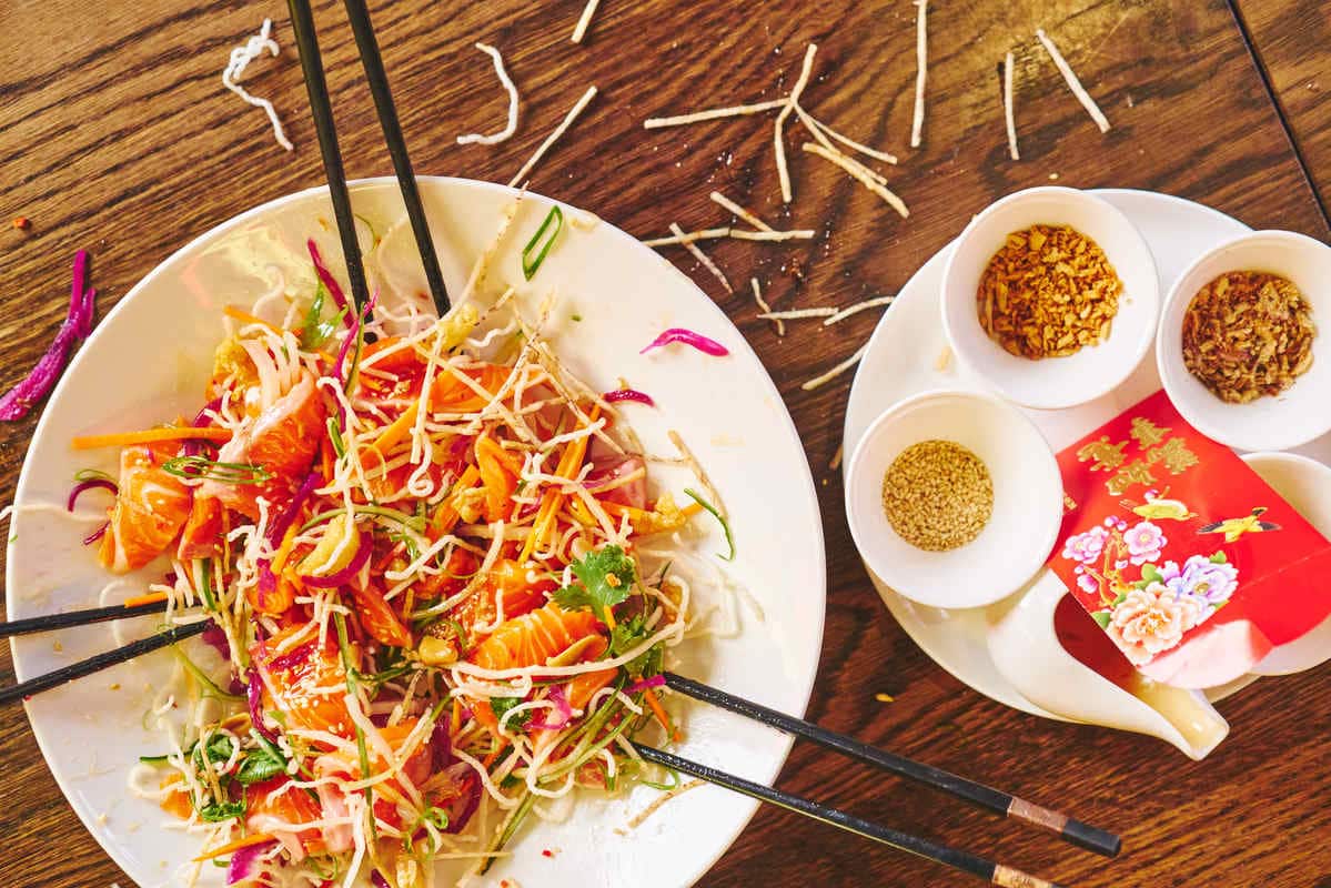     Yee sang (prosperity toss).                           