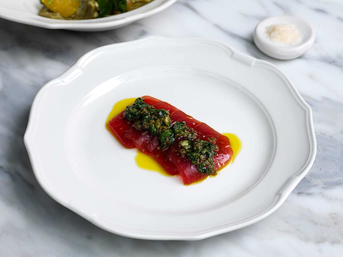 Raw plates (crudo) like this Yellofin tuna salsa verde are a menu highlight.