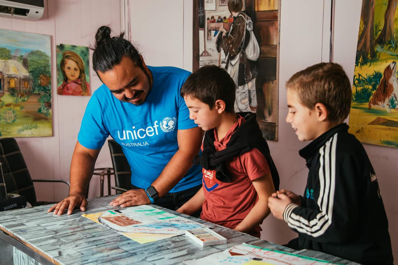 Adam Liaw with children in Jordan UNICEF