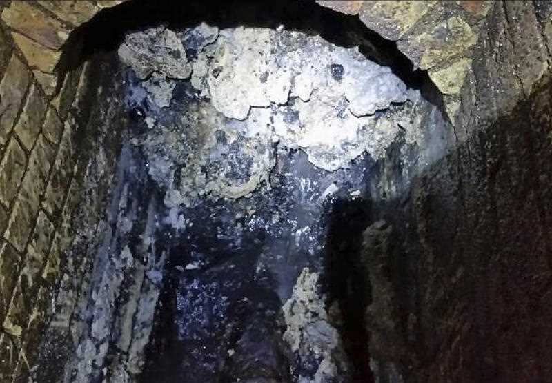 In this undated handout photo issued by Thames Water on Tuesday, Sept. 12, 2017, a view of a fatberg inside a sewer in Whitechapel, London.