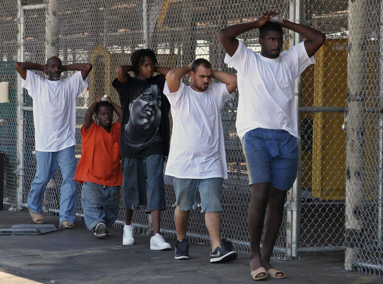 Inmates head back to their cells inside