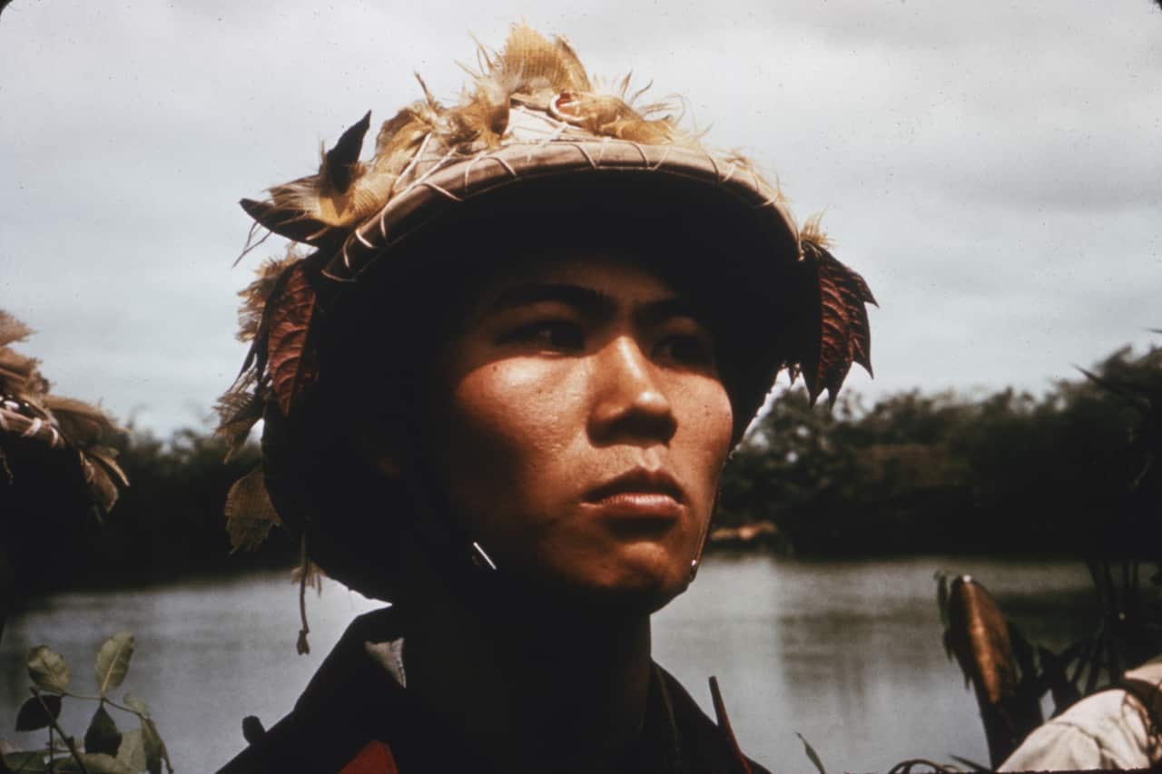 A close-up of a young soldier in camouflage gear, North Vietnam.