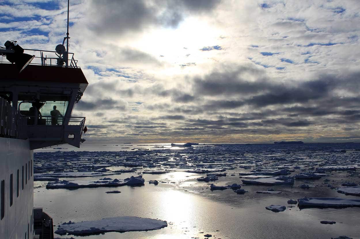 Captain Knowledge Bengu looks on from the bridge as Agulas II navigates a band of sea ice in the Weddell sea