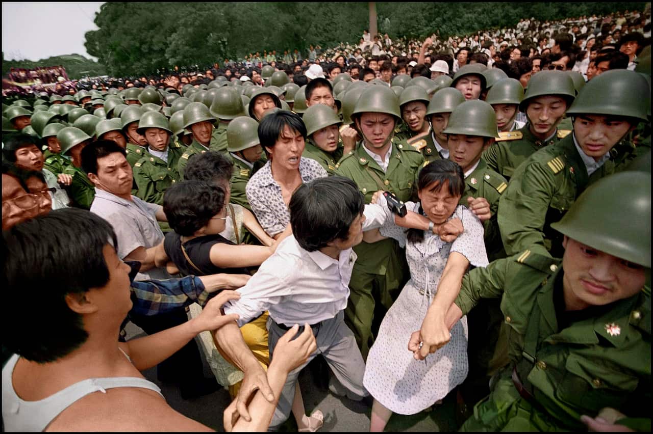 Students and PLA soldiers clash during the protests in the square.