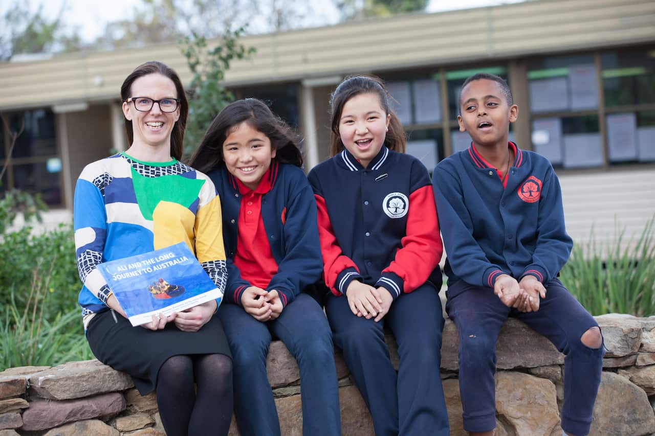 Monash researcher Mervi Kaukko with Noble Park Primary school students.