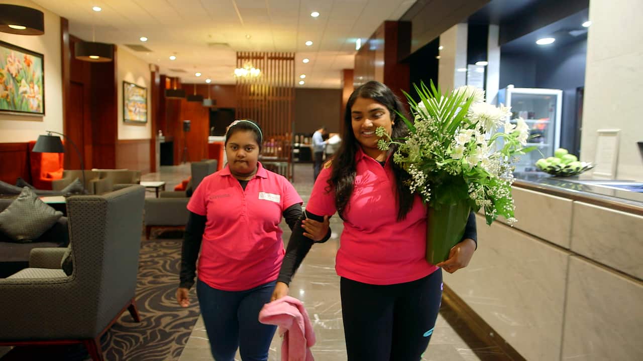 Nipuni Wijewickrema helping Gayana on her weekly delivery route.