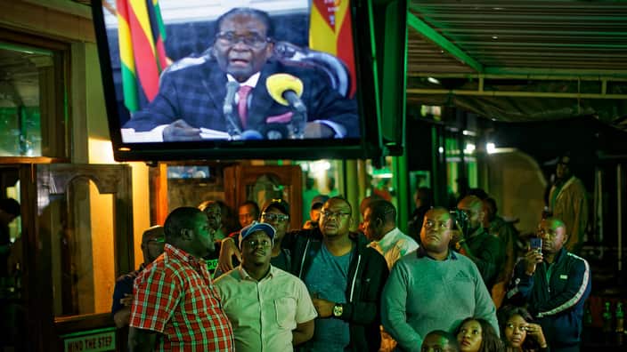 Robert Mugabe, and Zimbabweans watching him addresing vi Tv to nation