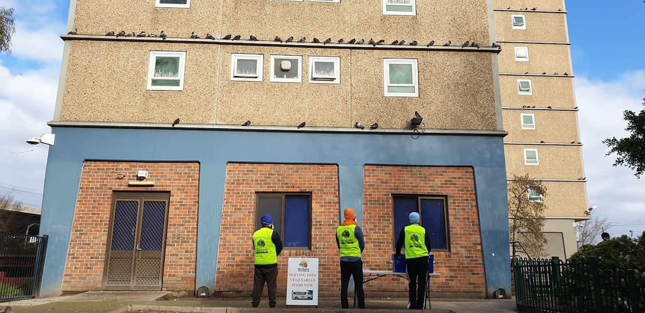 A team from Sikh Volunteers Australia outside a tower in Kensington