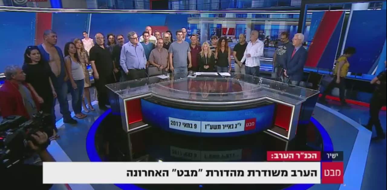 Staff crowded the set on the main news show's final broadcast.