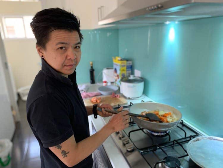 Tiff Tan cooking in her home