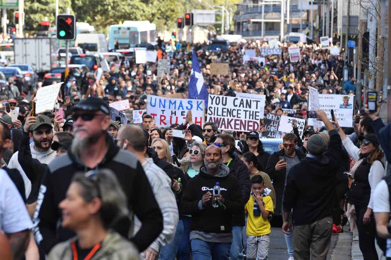 Protesters march along Broadway and George St towards Sydney Town Hall during the ‘World Wide Rally For Freedom’ anti-lockdown rally at Hyde Park in Sydney, Saturday, July 24, 2021. (AAP Image/Mick Tsikas) NO ARCHIVING