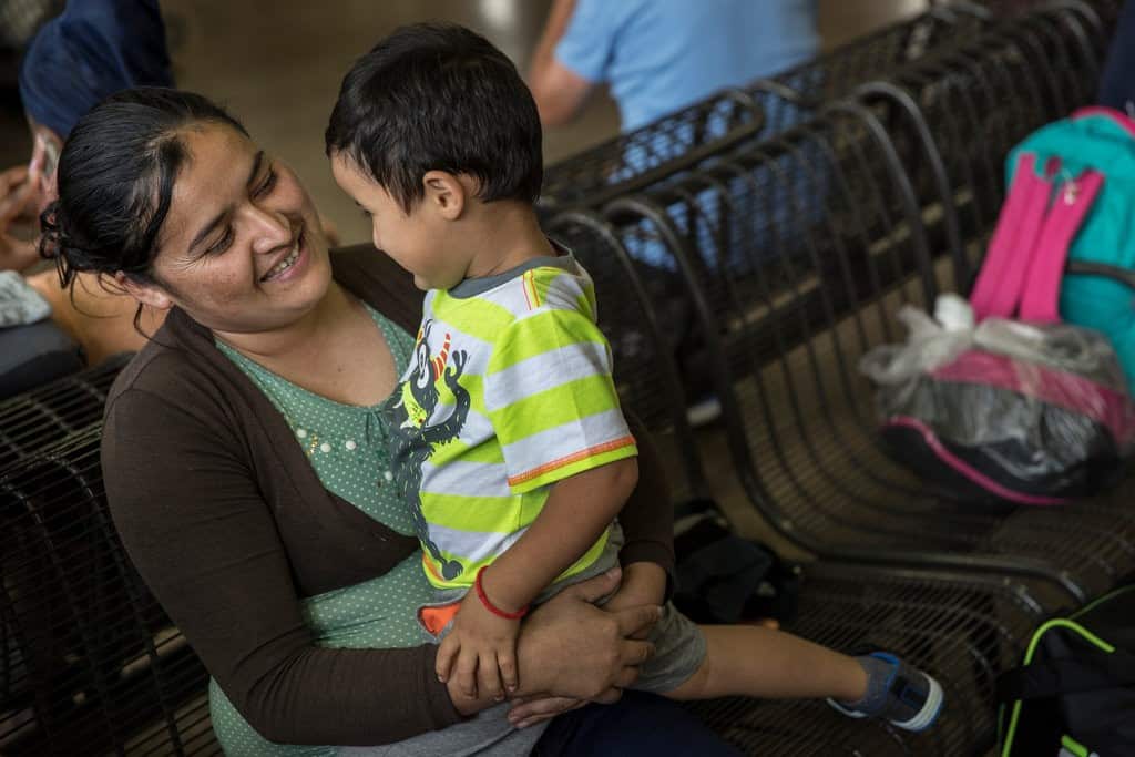 Mirce Alba Lopex holding her 3-year-old son.