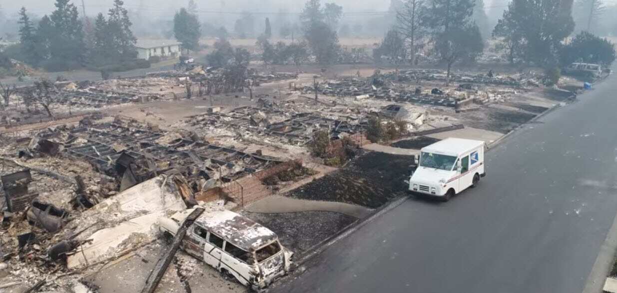 Drone footage captured of a U.S.P.S. postman delivering mail in wildfire ravaged Santa Rosa.
