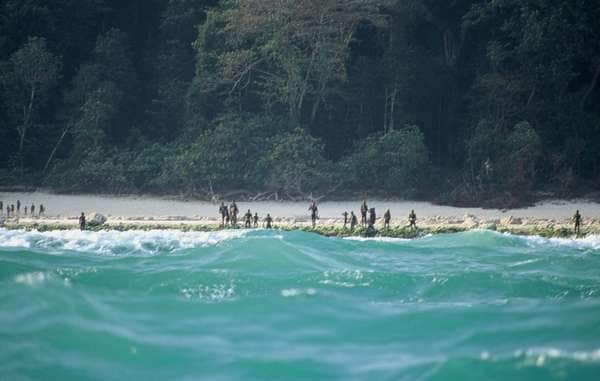 The Sentinelese stand guard on an island beach.