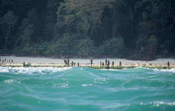 The Sentinelese stand guard on an island beach.