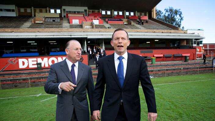 Australian Prime Minister Tony Abbott (right) walking with Steve Irons MP for Swan at Lathlain Oval, Saturday, Aug, 22, 2015.