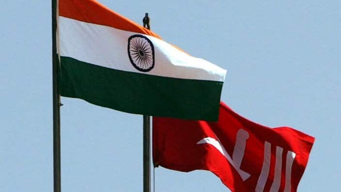 Indian national flag and the former flag of Indian-Administered Kashmir. 