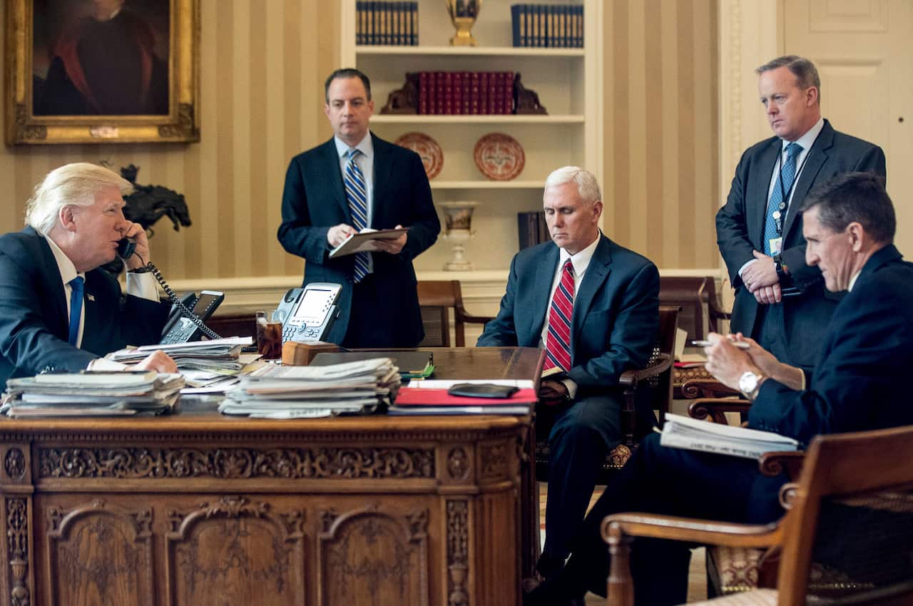 President Donald Trump accompanied by, from second from left, Chief of Staff Reince Priebus, Vice President Mike Pence, White House press secretary Sean Spicer.