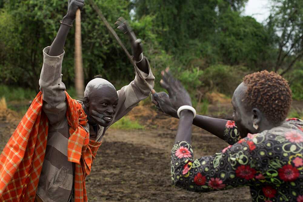Boys play-fight in the camp. (Matthew Abbott)
