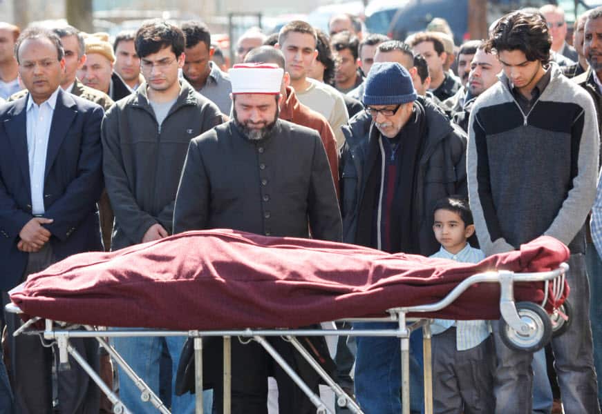 Imam Kasim Kopuz conducts a funeral service for Layla Khalil of Iraq after she was killed by a gunman at a civic center in Binghamton, New York in 2009