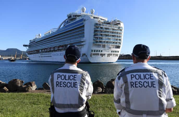 NSW Police Rescue officers look on as the Ruby Princess, with crew only onboard, docks at Port Kembla, Wollongong.