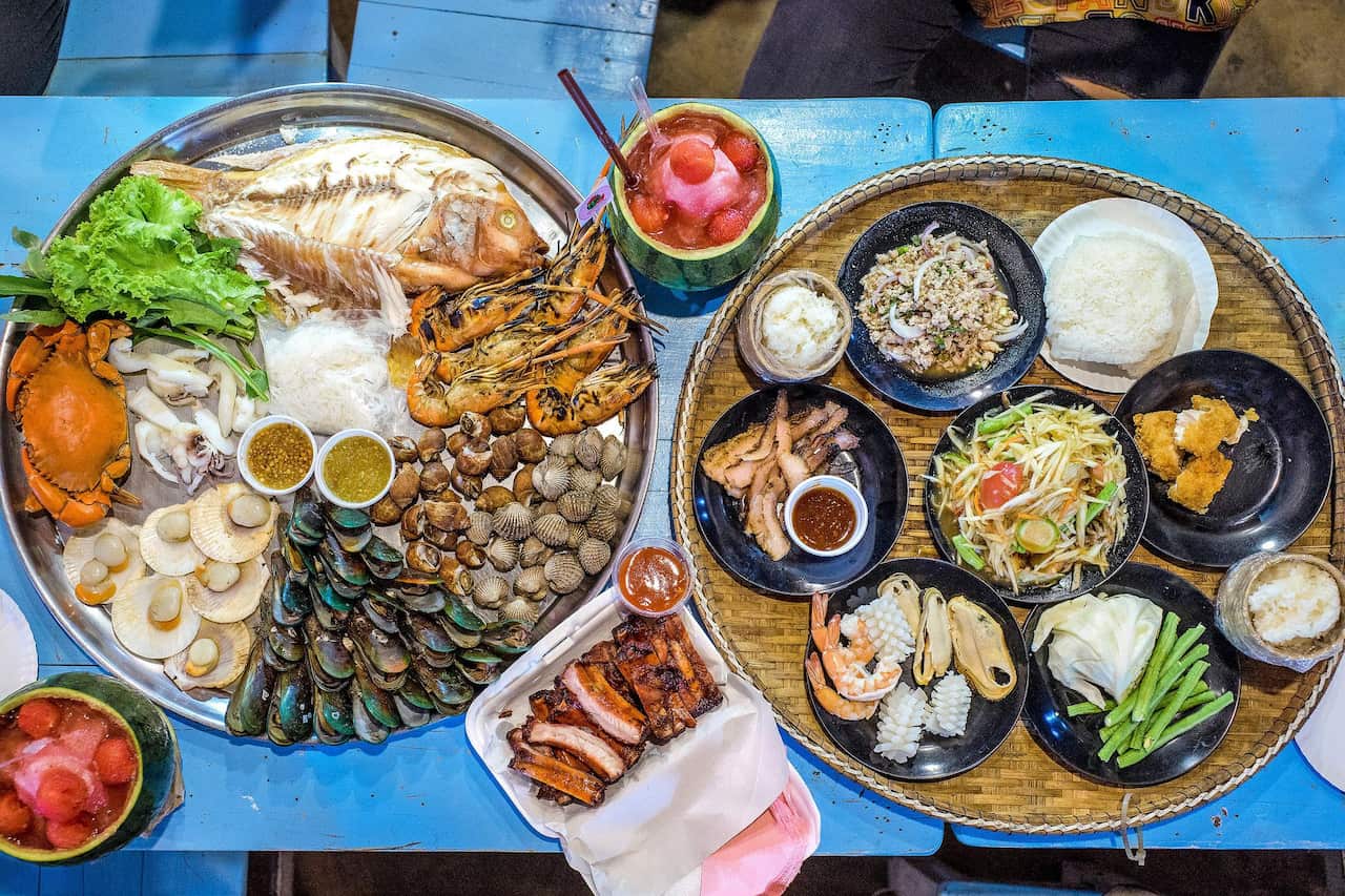 A big meal consisting of a seafood platter, pork ribs and Isan dishes like papaya salad or pork salad.