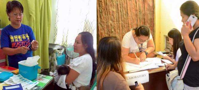 Bustos Bulacan Chief Nurse Estelita Mariano about to vaccinate a newborn baby.