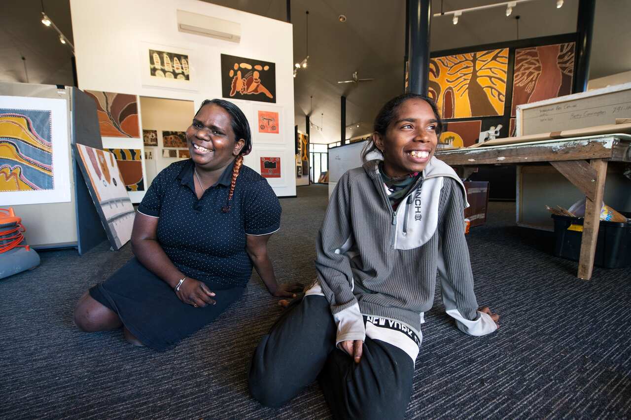 Marika Riley and April Nulgit at the Warmun Art Centre gallery.