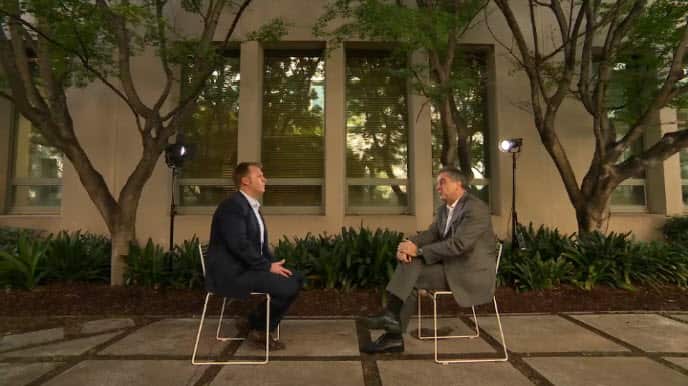 Mr Stamm, left, with SBS World News political correspondent Brett Mason.