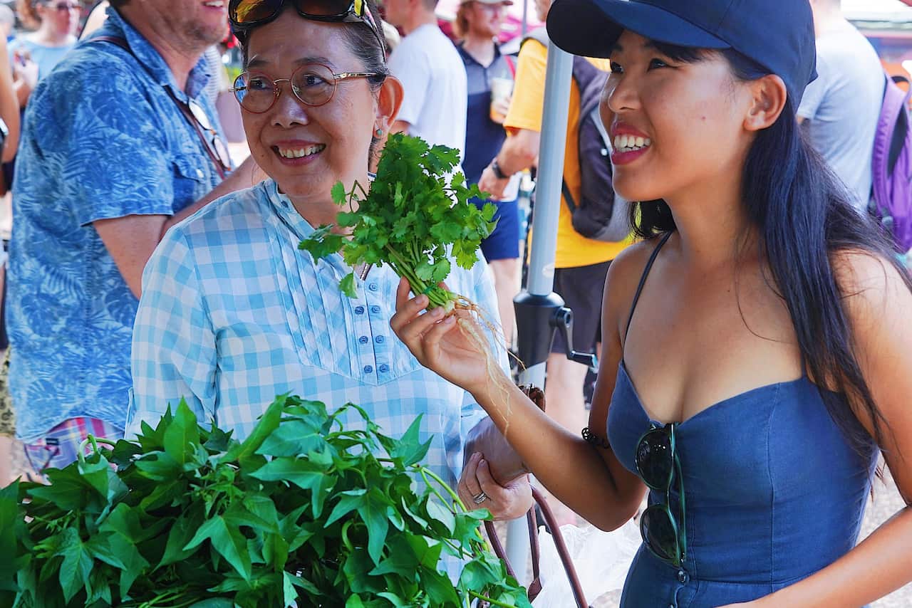 Ms Tejaya with her aunt Hong looking at fresh produce for her illustrations.