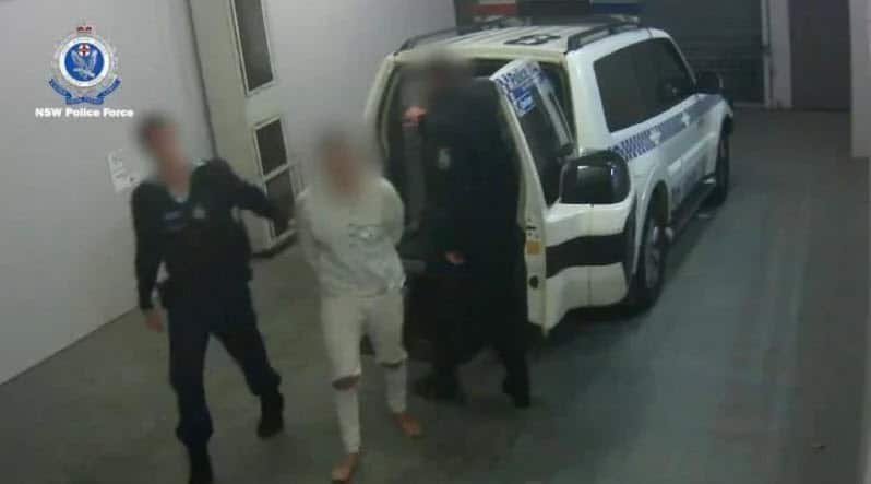 The accused led by police after his arrest.