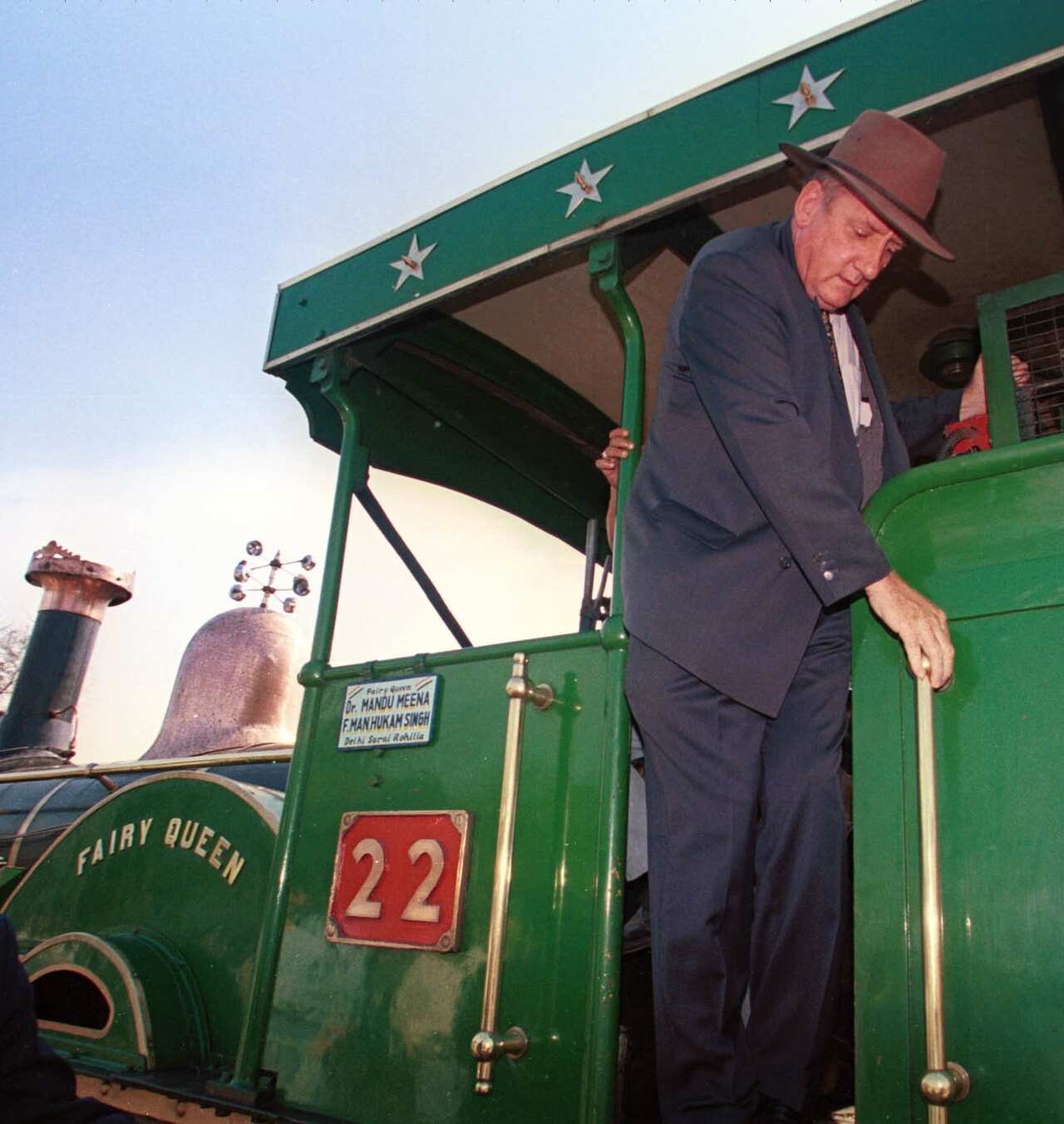 Australian Deputy Prime Minister and Minister of Trade Tim Fischer steps down off the Fairy Queen Express, the world's oldest operational steam locomotive, Friday February 26, 1999 during a visit to New Delhi. (AP Photo/John McConnico)