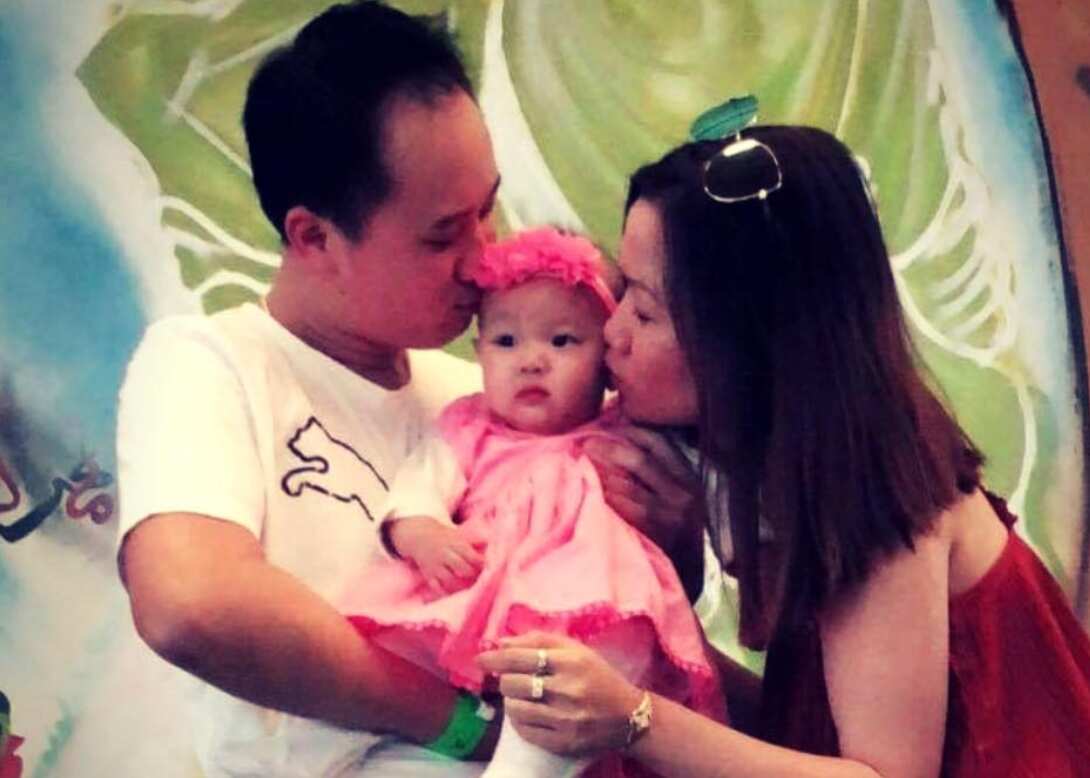 Huyen Thu Thi Tran (right) kisses Isabella Lee Pin Loong.