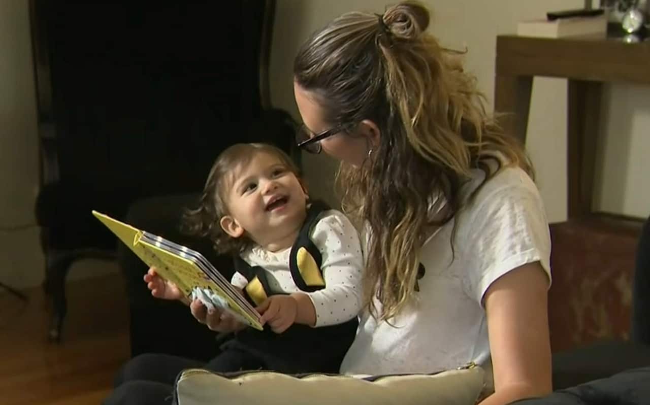 Carlie Kilikas and one of her children.