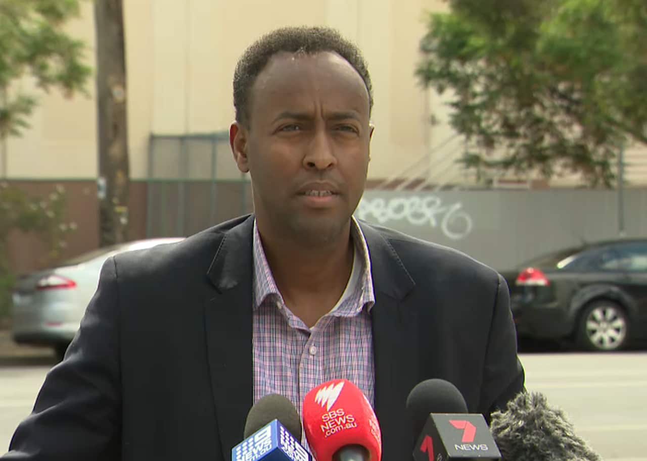 Sharmake Farah talks to reporters.