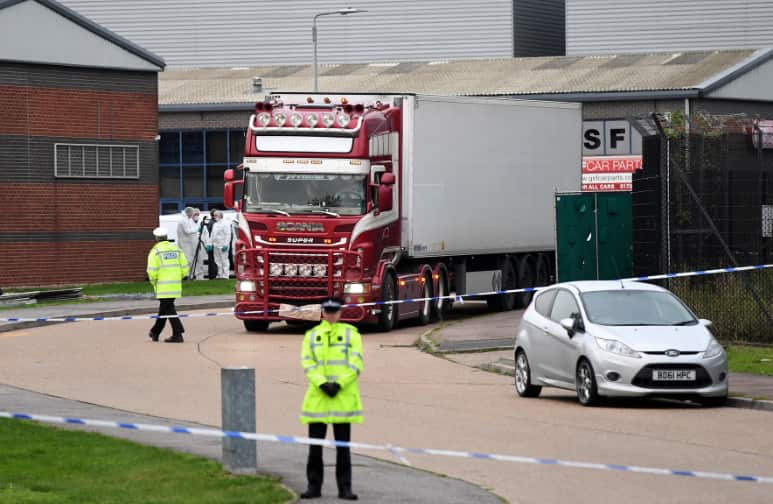 The lorry where 39 people were found dead inside leaves Grays, Essex.