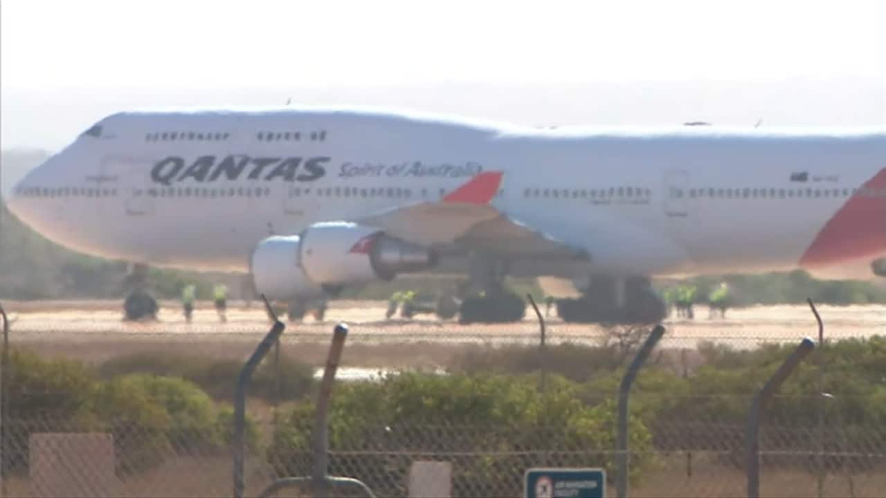 The plane lands in WA.