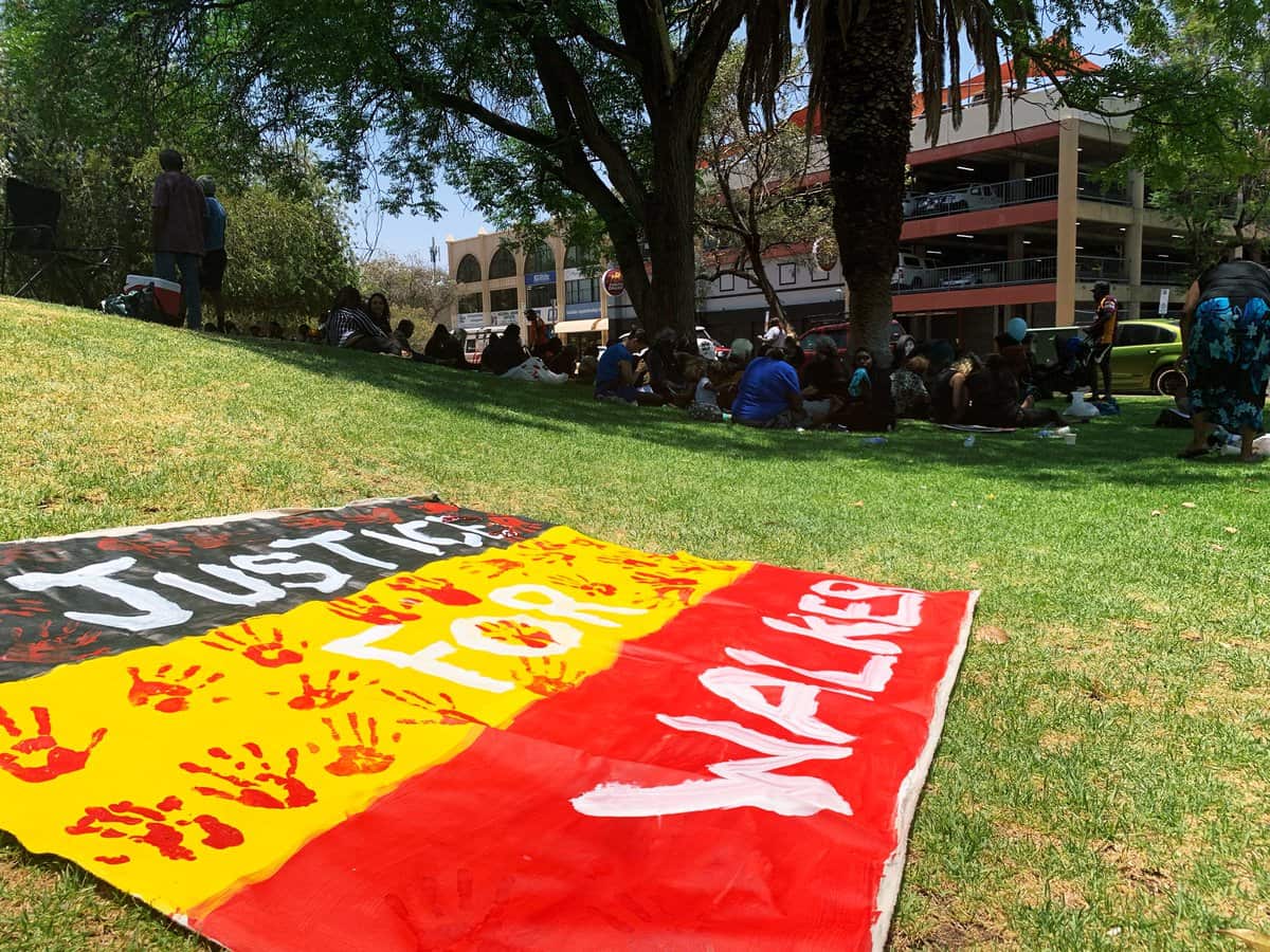Yuendumu and surrounding towns came to the Alice Springs Local Court lawns with signs saying Justice for Walker