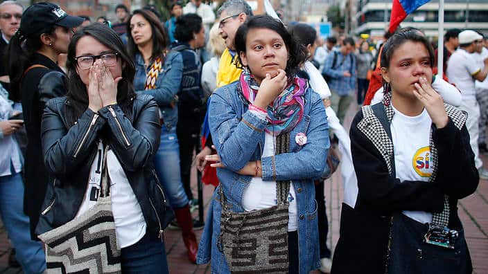 Supporters of the peace accord signed between the Colombian government and FARC, follow on a giant screen the results of the referendum.