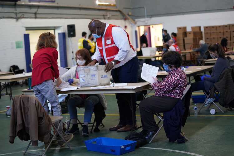 Election officials in Wisconsin and Georgia, said recounts in those states were very unlikely to reverse Donald Trump's losses.