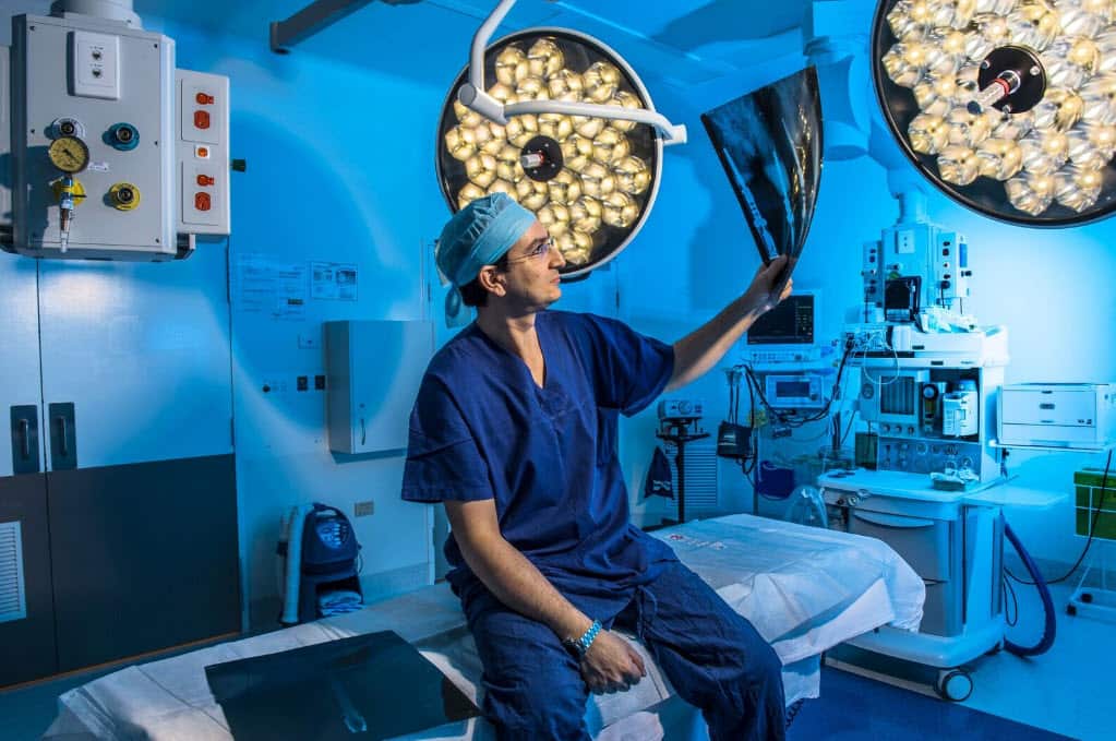 Dr Munjed Al Muderis examines an X-ray.