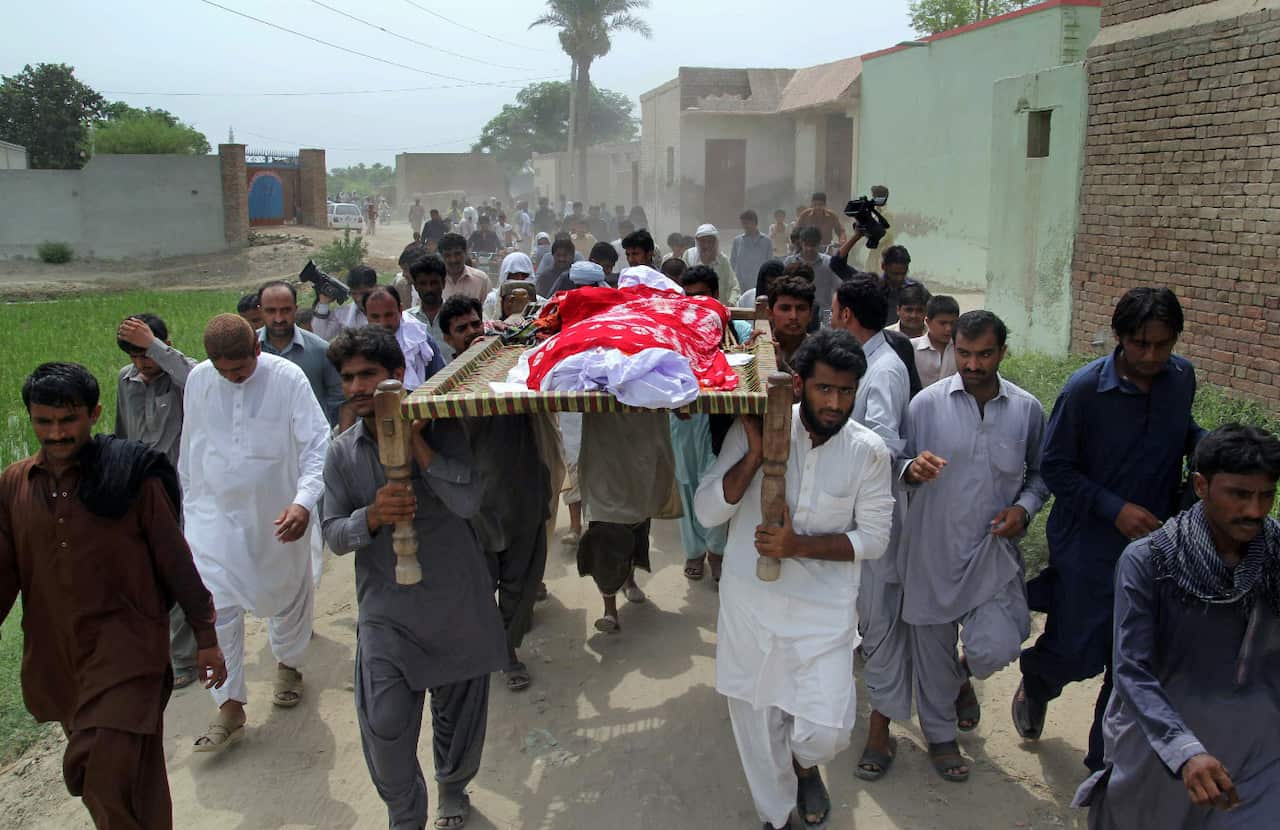 Relatives and local residents carry the coffin of slain model Qandeel Baloch for funeral prayers in Shah Sadar Din village, near Dera Ghazi Khan, Pakistan,