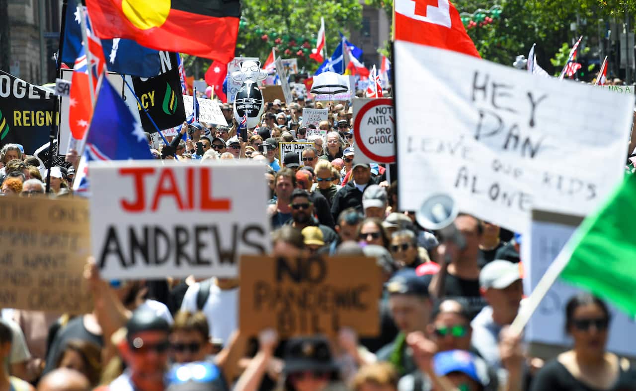 People participate in 'The Worldwide Rally for Freedom' protest against in Melbourne, Saturday, 20 November, 2021.